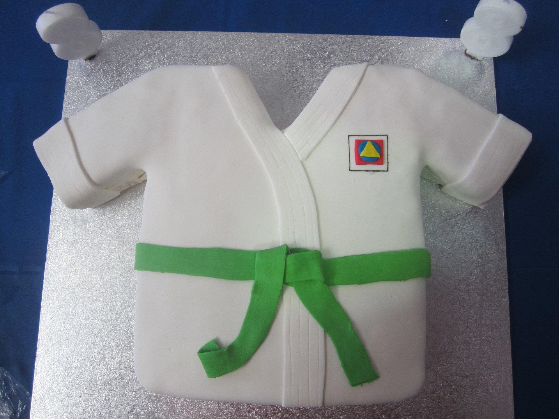 Custom karate gi birthday cake with green belt